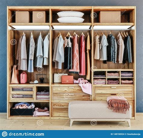 Discover a variety of storage and closet ideas, including layout and organization filter, save & share beautiful closet remodel pictures, designs and ideas. Modern Wooden Wardrobe With Clothes Hanging On Rail In ...