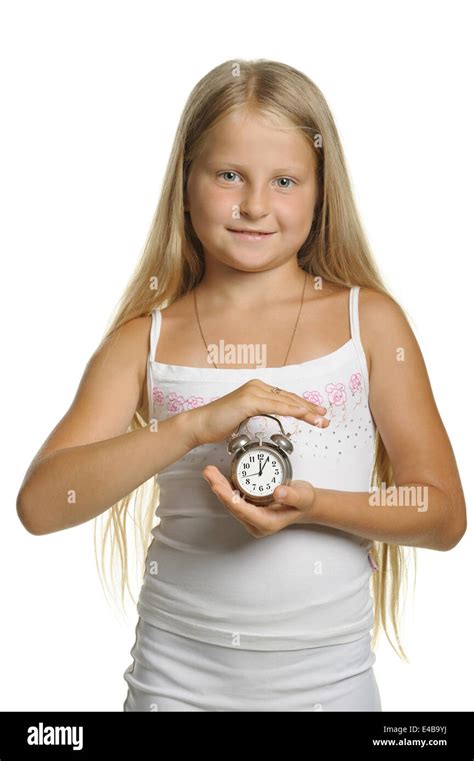 The Girl Holds An Alarm Clock In Hands Stock Photo Alamy
