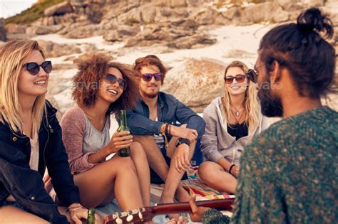 Diverse Group Of Friends Hanging Out At Beach Stock Photo By Jacoblund