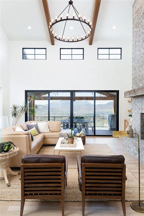 High Ceiling Two Story Living Room Chandelier And Windows Grey Barn
