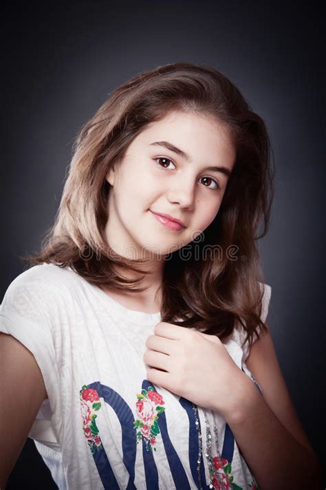 Beautiful Teen Girl With Long Straight Hair Posing On Background Stock