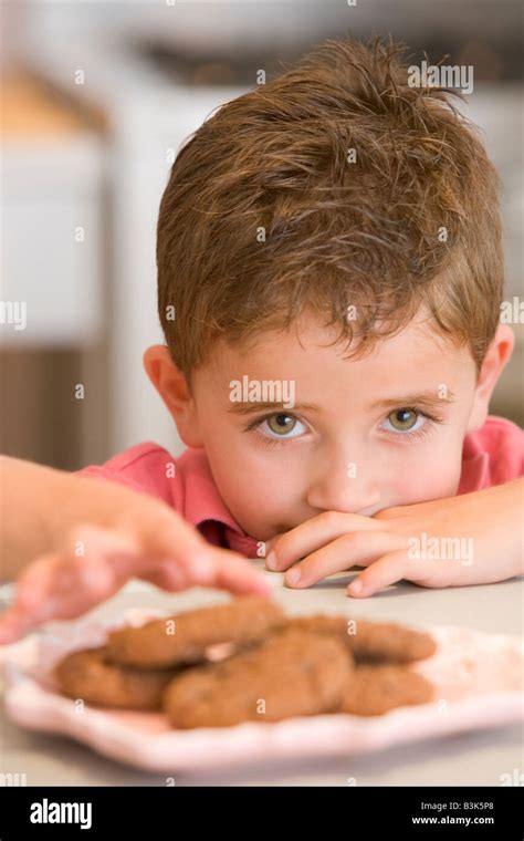 Child Stealing Biscuit Hi Res Stock Photography And Images Alamy