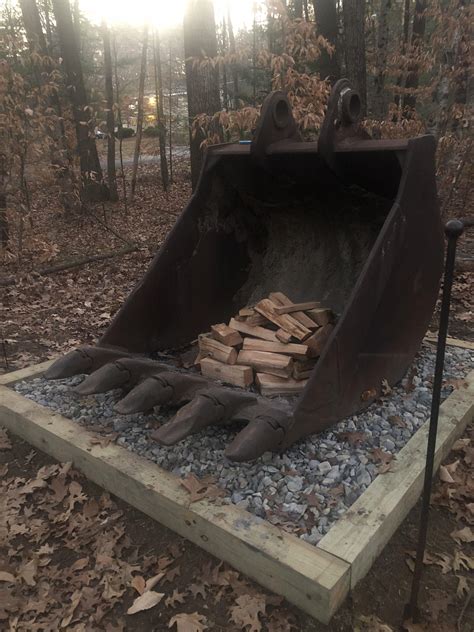 My dad's new fire pit is a 60 inch excavating bucket. : mildlyinteresting
