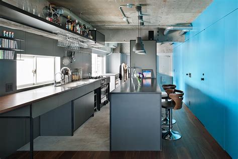 Minimalist And Industrial Apartment Design With Turquoise Accents