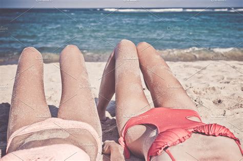 Two Happy Sexy Women Friends Sunbathing On The Tropical Beach Of Bali Island Nusa Dua