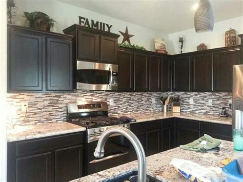 If the kitchen is having 4 rows of 150mm tiles you may want to put the bottom of the wall units a little above the finished tile. 42 best Decor above kitchen cabinets images on Pinterest ...