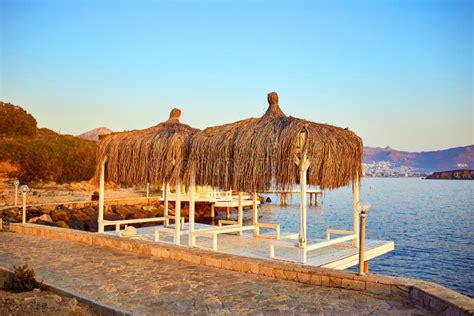 Bungalow On The Sea At Sunset Wooden Pavilions On The Shore Of A Sandy