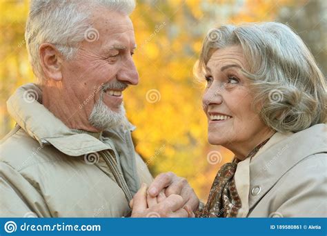 Beautiful Senior Couple Holding Hands In The Park Stock Image Image