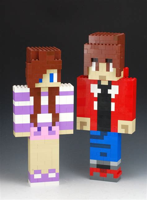 Two People Made Out Of Legos Standing Next To Each Other