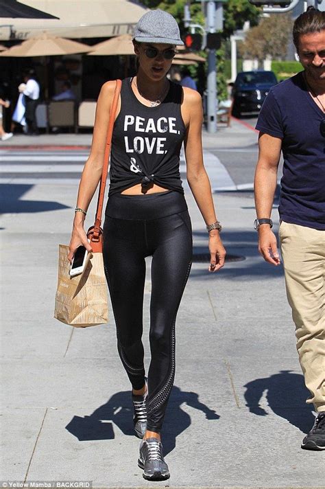 All Tied Up Alessandra Ambrosio Flaunts Washboard Abs In Slogan Vest Trendy Workout Outfits