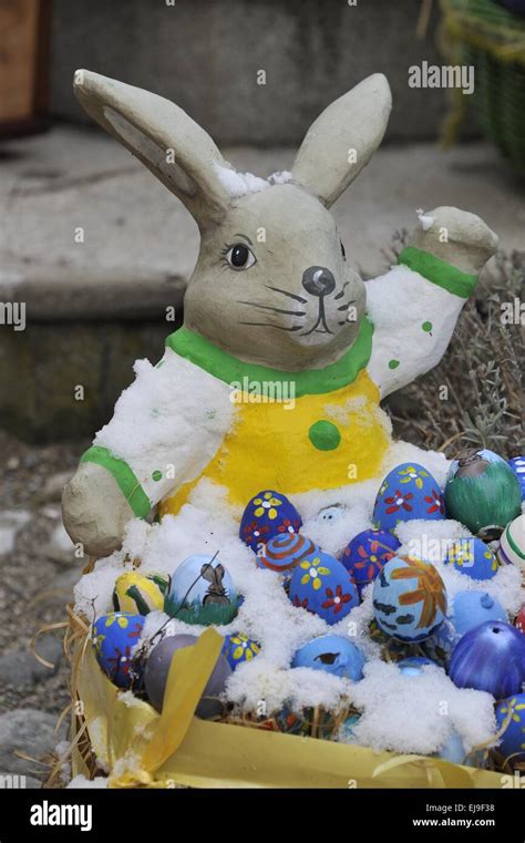 Easter Bunny And Eggs Covered With Snow Stock Photo Alamy