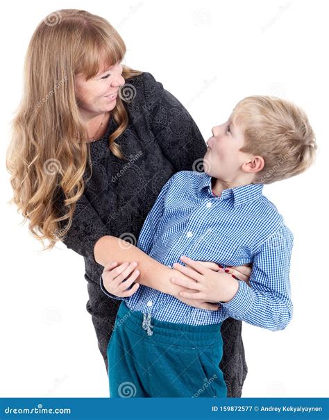 blond mother and her son admire each other embracing and laughing isolated on white background