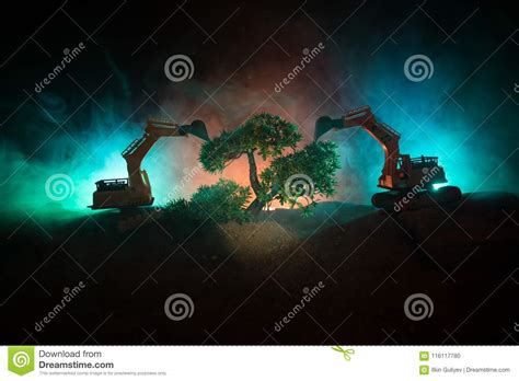Deforestation Of Forest Excavator Used To Dig Up Tree Stumps And Roots