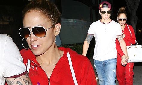 jennifer lopez covers up in a bright red hooded one piece as she grabs a low key dinner with