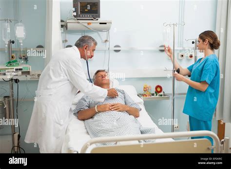 Doctor Checking Heartbeat Of Patient With Stethoscope Stock Photo Alamy