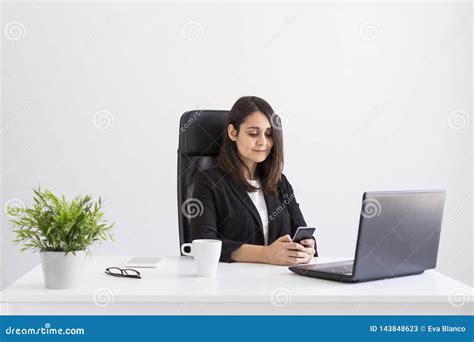 Beautiful Young Business Woman Working In The Office Using Her Laptop