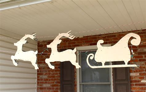 Outdoor sleigh christmas decoration santa in sleigh reindeer outdoor wood decoration oneartsyday. How to Make a Hanging Santa Sleigh and Reindeer for $20 ...