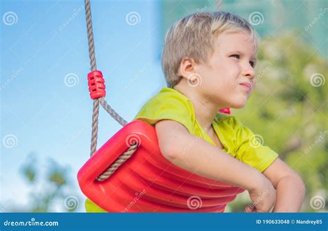 Sad Lonely Boy Sit On Swing Look Far Away Wait For Friends Or While