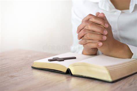 Hands Praying On A Holy Bible Spirtuality And Religion Religious