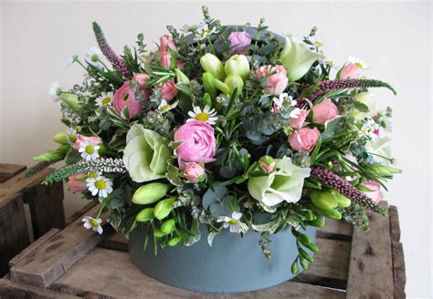 Hatbox Filled With Pink And Cream Dainty Flowers Floral Arrangements