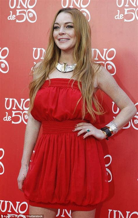 Lindsay Lohan Displays Her Slender Legs In A Red Bubble Hem Dress