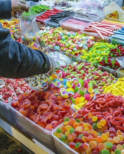 Hand Picking Up Colorful Candies Stock Photos Free And Royalty Free