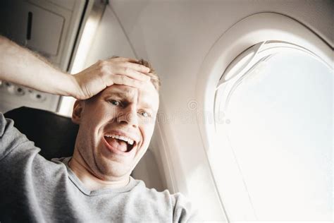 Male Passenger In Plane Screams And Cries Aerophobia Background Of
