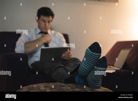 Businessman Using Digital Tablet In Bedroom Stock Photo Alamy