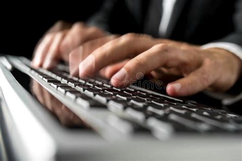 Hands Of A Man Typing Fast On A Computer Keyboard Stock Photo Image