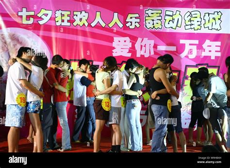 Couples Of Chinese Lovers Kiss Each Other At A Kiss Contest To