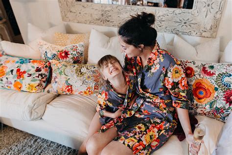 Mother And Daughter Sitting On Couch By Stocksy Contributor Leah Flores Stocksy