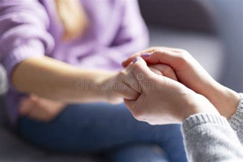 Close Up Of A Female Psychologist Holding Woman S Hands During A