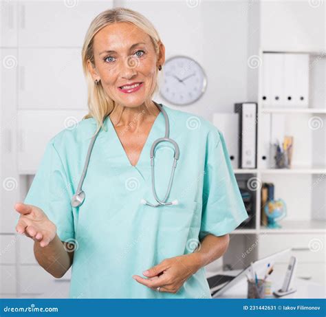 Mature Female Doctor Welcoming To Clinic Stock Image Image Of Medicine Lady 231442631