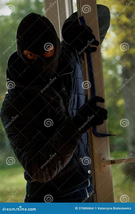 Masked Burglar Using Lock Picker To Open Locked Door Royalty Free Stock Image Cartoondealer