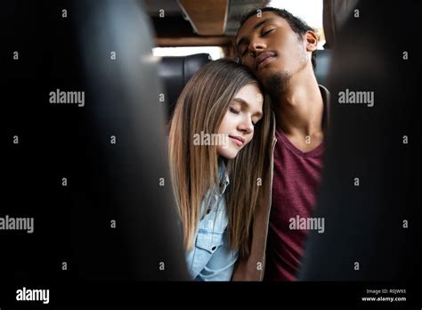 Selective Focus Of Young Interracial Couple Sleeping During Trip On