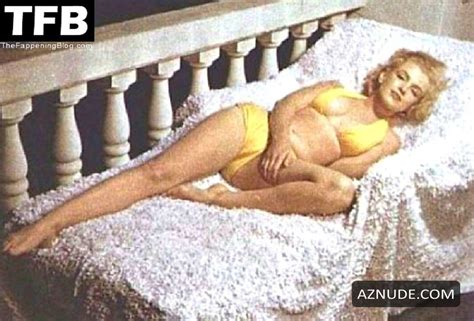 Marilyn Monroe Sexy Poses Showing Off Her Hot Figure Wearing A Yellow Bikini In A Photoshoot