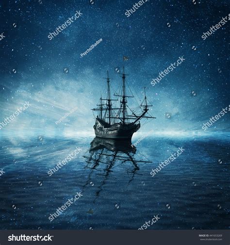 A Ghost Pirate Ship Floating On A Cold Dark Blue Sea Landscape With A
