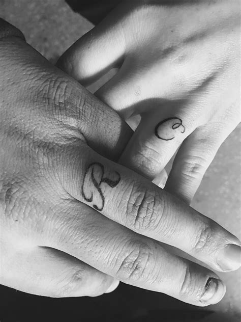 His And Her Initial Tattoo On Ring Finger Couple Ring Finger Tattoos