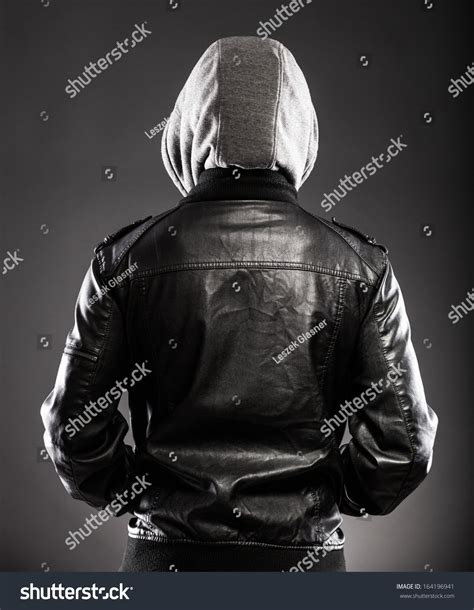 Young Man In Leather Jacket And Hood Rear View Royalty Free Stock