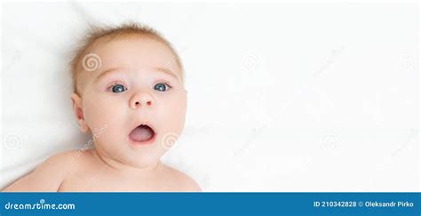 Portrait Of An Astonished Cute Newborn Baby The Boy A Surprised