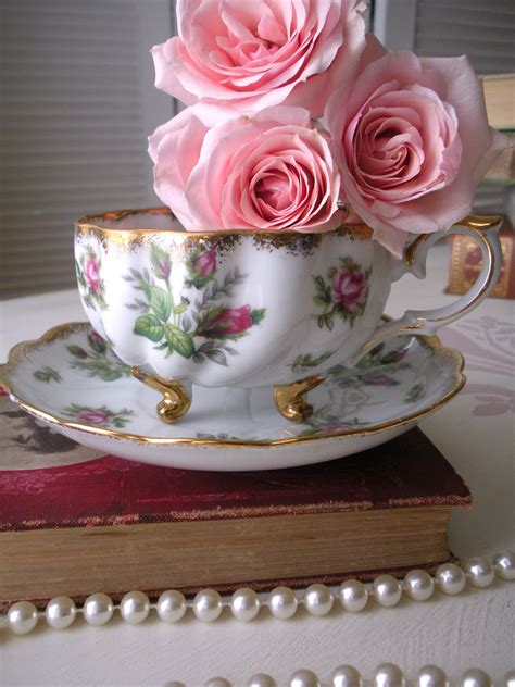 Some Pink Roses Are In A Tea Cup