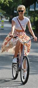 Karlie Kloss Wears A Tea Length Skirt As She Enjoys A Bike Ride In New