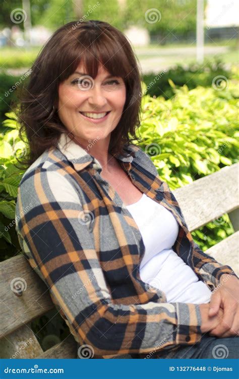 Beautiful Happy Mature Caucasian Woman Outside In The Park Stock Photo Image Of Adult Holding
