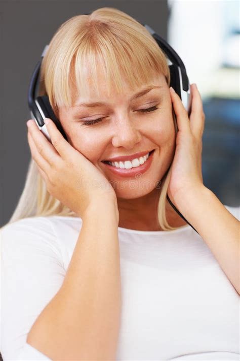 Woman With Eyes Closed Listening To Music Closeup Of Relaxed Young