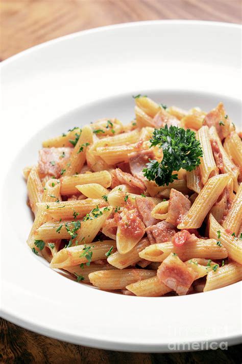 Penne Amatriciana Tomato And Ham Sauce Pasta On Wood Table Photograph