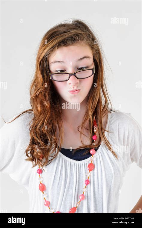 Nerd Girl With Big Glasses Crossed Eyes And Pursed Lips With