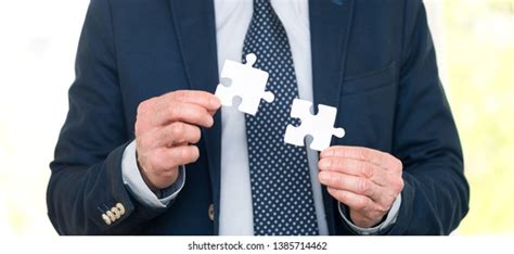 Businessman Joining Two Puzzle Pieces Teamwork Stock Photo 1385714462