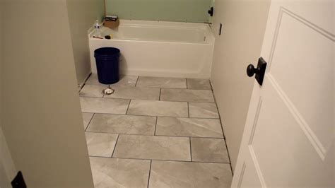 Make sure that your pattern is set and you are. Laying Tile on a Bathroom Floor - YouTube