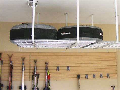 Overhead storage racks attach to the ceiling to provide a safe, dry area for luggage, seasonal items. Diy Overhead Garage Storage Pulley System - Storage Ideas ...