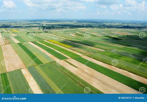 Aerial View Of The Countryside With Village And Fields Of Crops Stock